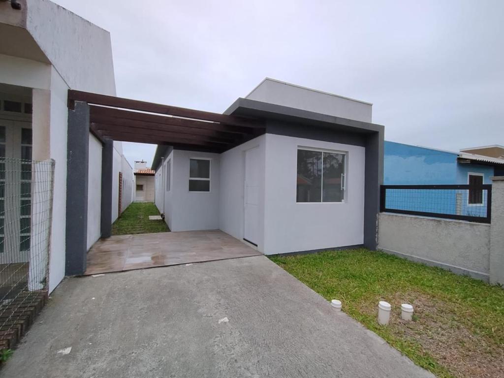Casa 2 dormitórios para venda, Village em Capão da Canoa | Ref.: 1775